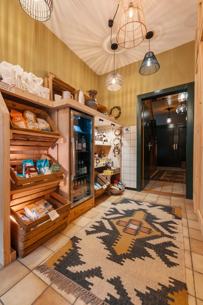Farmhouse farm shop with shelves, fridge and bathrobes, Hof Bissee
