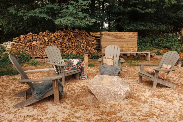 BBQ area Forrest: Seating circle with blankets and woodpile, Hof Bissee