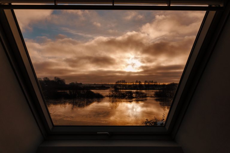 Cabin Forrest: View from the roof window of the sunset over the Eider, Hof Bissee
