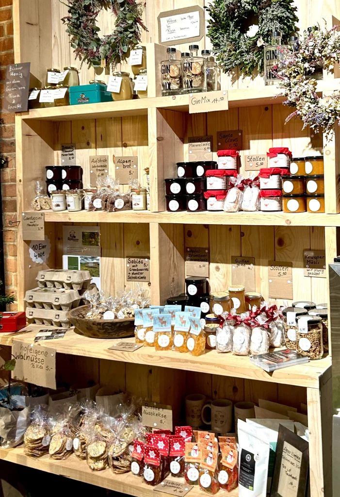 Farm shop shelf in the Corn Barn with jams, stollen and biscuits, Hof Bissee