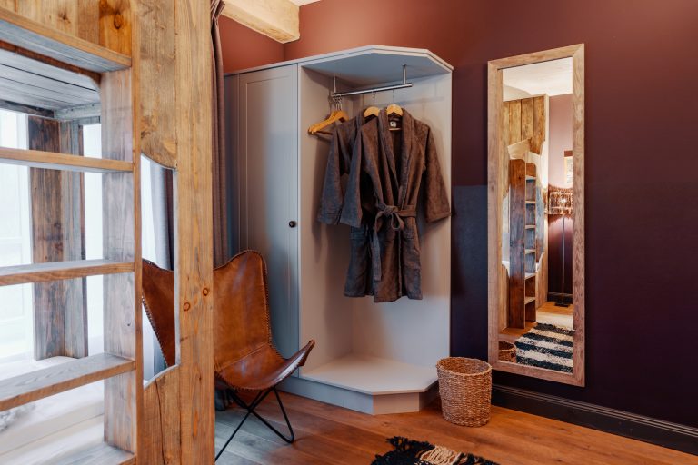 Room No.3: Coat rack with bathrobes and a mirror, Hof Bissee