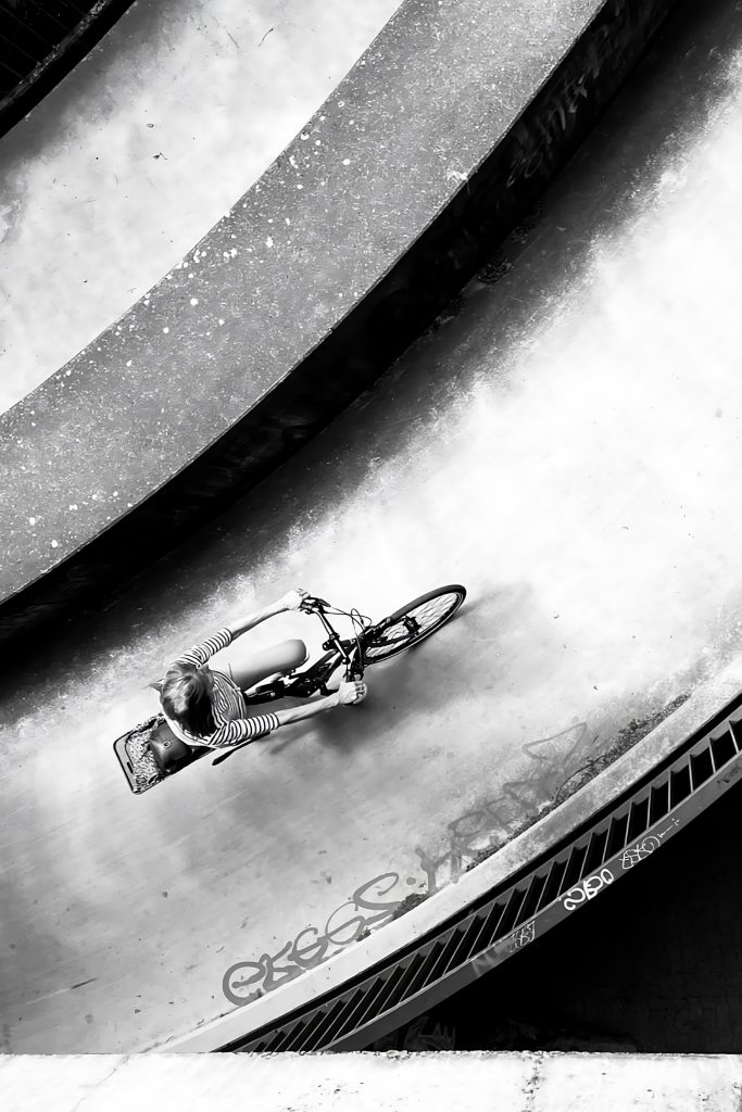 Art exhibition SVENSØN: Cyclist on a curved ramp, Hof Bissee