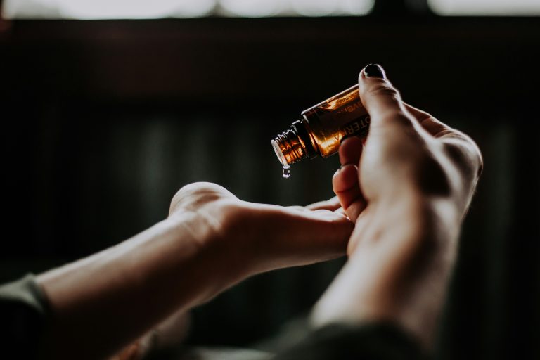 Massage oil being dripped onto a hand, Hof Bissee