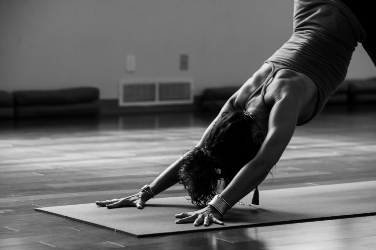 Yoga: downward-facing dog on the mat, Hof Bissee